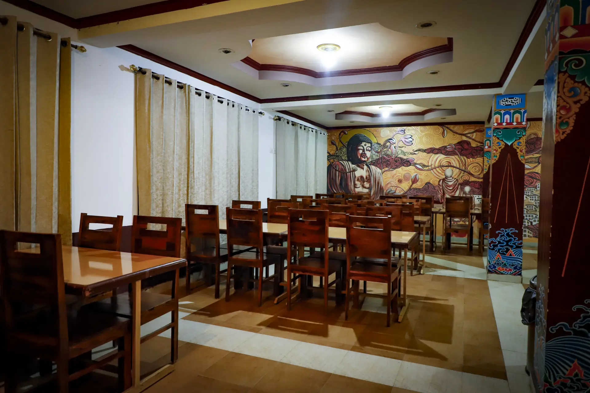 Delek Cafe wide view with Buddha mural wall art